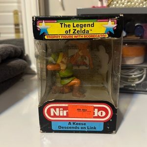 Legend of Zelda trophy figure with scorecard unopened
